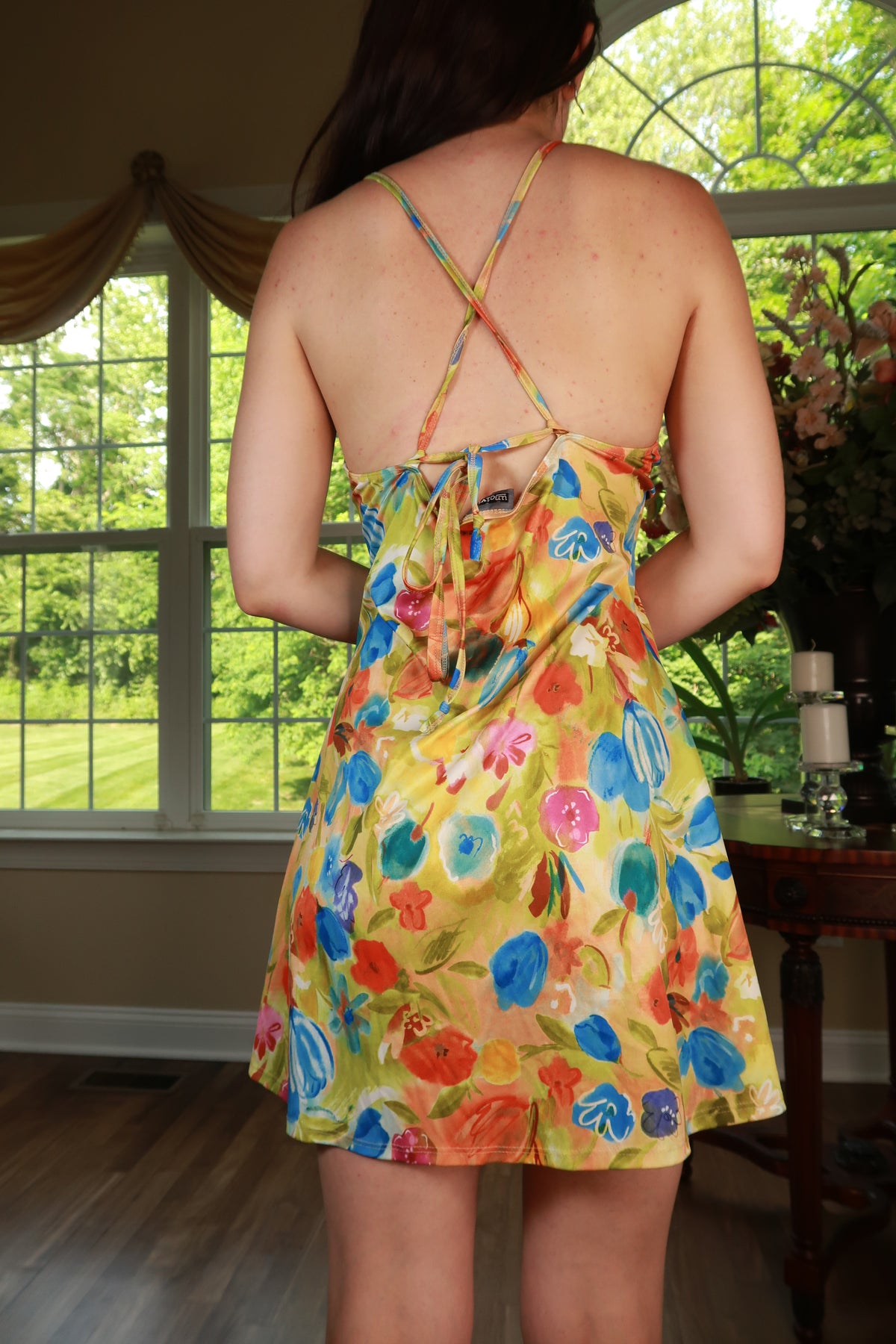 Vintage Elektra Vintage Y2K watercolor floral crisscross back mini dress, front view showing vibrant floral print and stylish design.