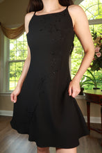 Load image into Gallery viewer, Vintage black beaded floral slip dress by Elektra Vintage, featuring intricate beadwork and a delicate floral pattern.
