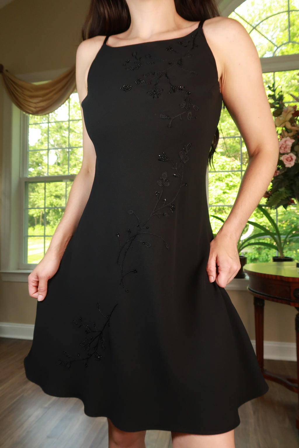 Vintage black beaded floral slip dress by Elektra Vintage, featuring intricate beadwork and a sleek, elegant silhouette.