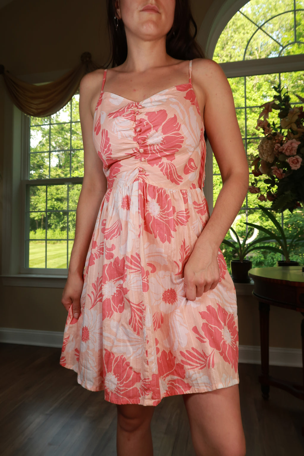 Vintage Y2K Guess pink floral babydoll mini dress by Elektra Vintage, featuring a fitted bodice and flowy skirt.