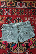 Load image into Gallery viewer, Vintage LEI Camo Denim Shorts – Y2K Low-Rise Button-Fly Cargo Style

