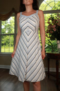 Vintage blue and white chevron stripe fit and flare sundress by Elektra Vintage, showing its sleeveless design and knee-length style.