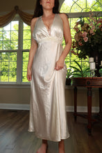 Load image into Gallery viewer, Vintage ivory satin empire waist maxi dress by Elektra Vintage, flowing fabric and elegant design displayed on a hanger.
