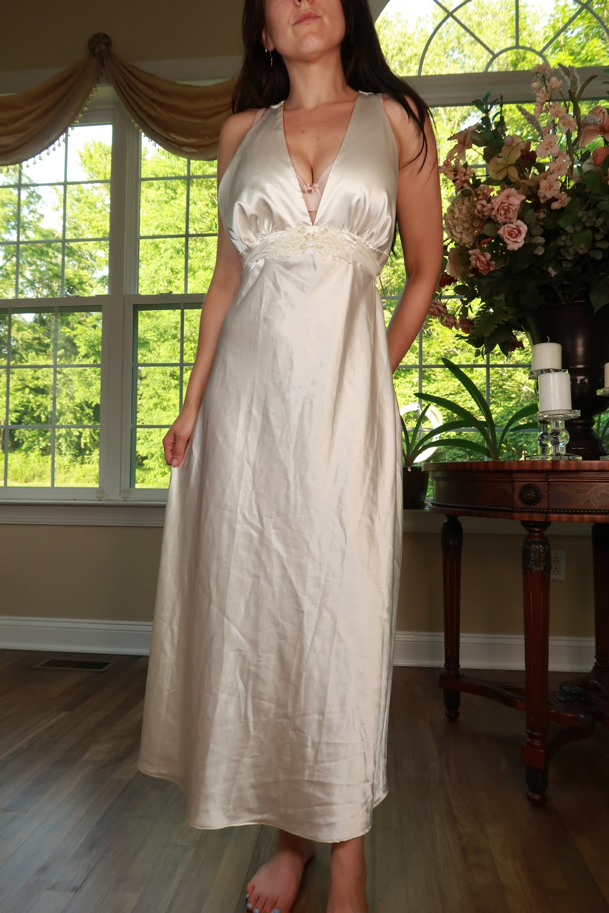 Vintage ivory satin maxi dress with empire waist by Elektra Vintage, featuring elegant flowing fabric and classic design.