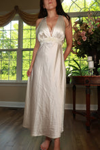 Load image into Gallery viewer, Vintage ivory satin maxi dress with empire waist by Elektra Vintage, featuring elegant flowing fabric and classic design.
