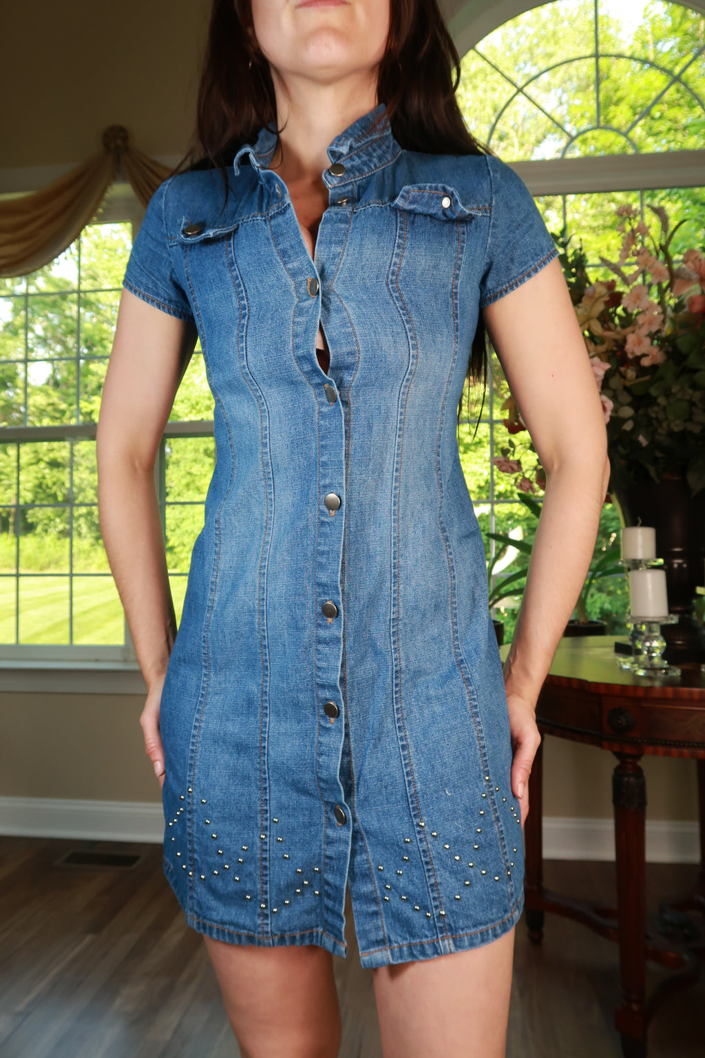 Vintage Elektra Y2K denim mini dress with snap front and studded pocket detail, showcasing a retro-inspired fashion look.