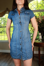 Load image into Gallery viewer, Vintage Elektra Y2K denim mini dress with snap front and studded pocket detail, showcasing a retro-inspired fashion look.
