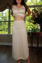 Load image into Gallery viewer, Vintage ivory satin maxi slip skirt by Elektra Vintage, flowing satin fabric with a smooth, elegant silhouette.
