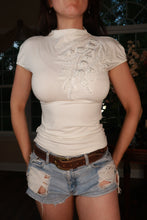 Load image into Gallery viewer, White beaded floral mock neck stretch top for women by Elektra Vintage, featuring vintage Y2K style and intricate bead detailing.
