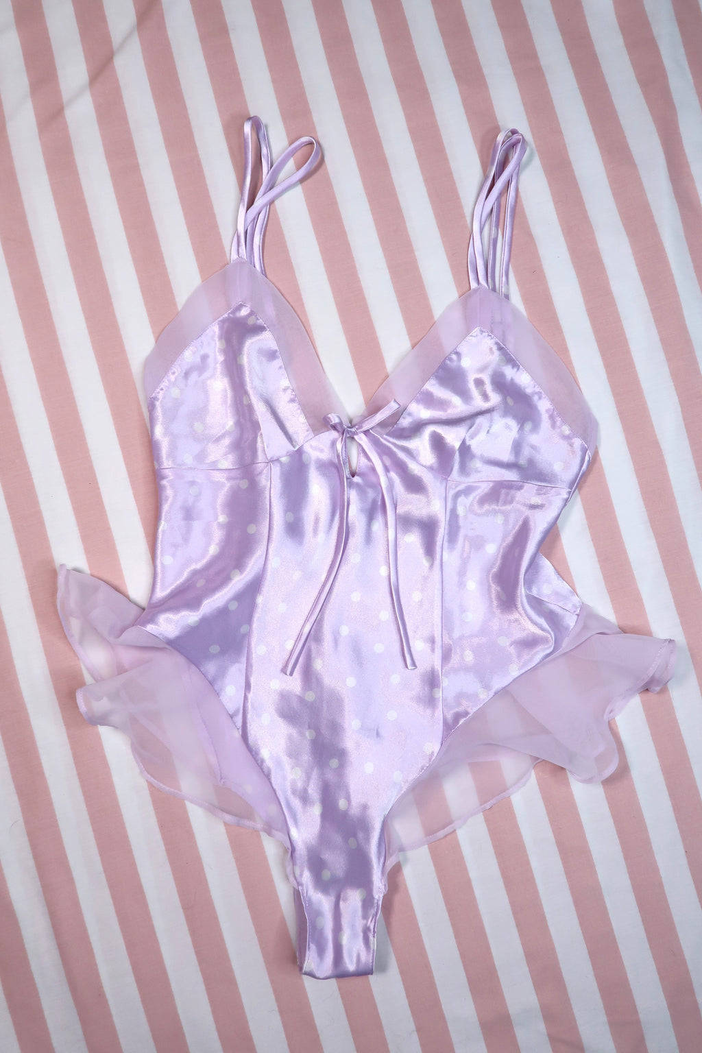Vintage 2000s Victoria’s Secret lavender satin polka dot bodysuit by Elektra Vintage, showcasing a Y2K-inspired women's lingerie top.