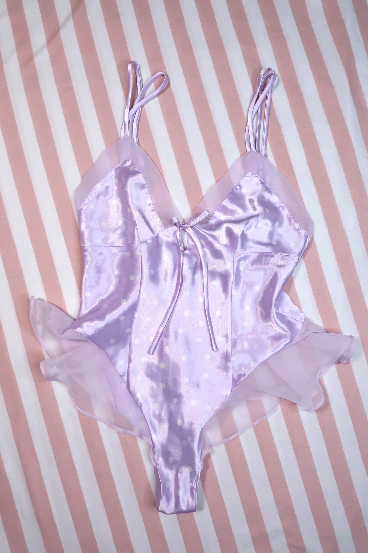 Vintage 2000s Victoria’s Secret lavender satin polka dot bodysuit by Elektra Vintage, showcasing a Y2K-inspired women's lingerie top.
