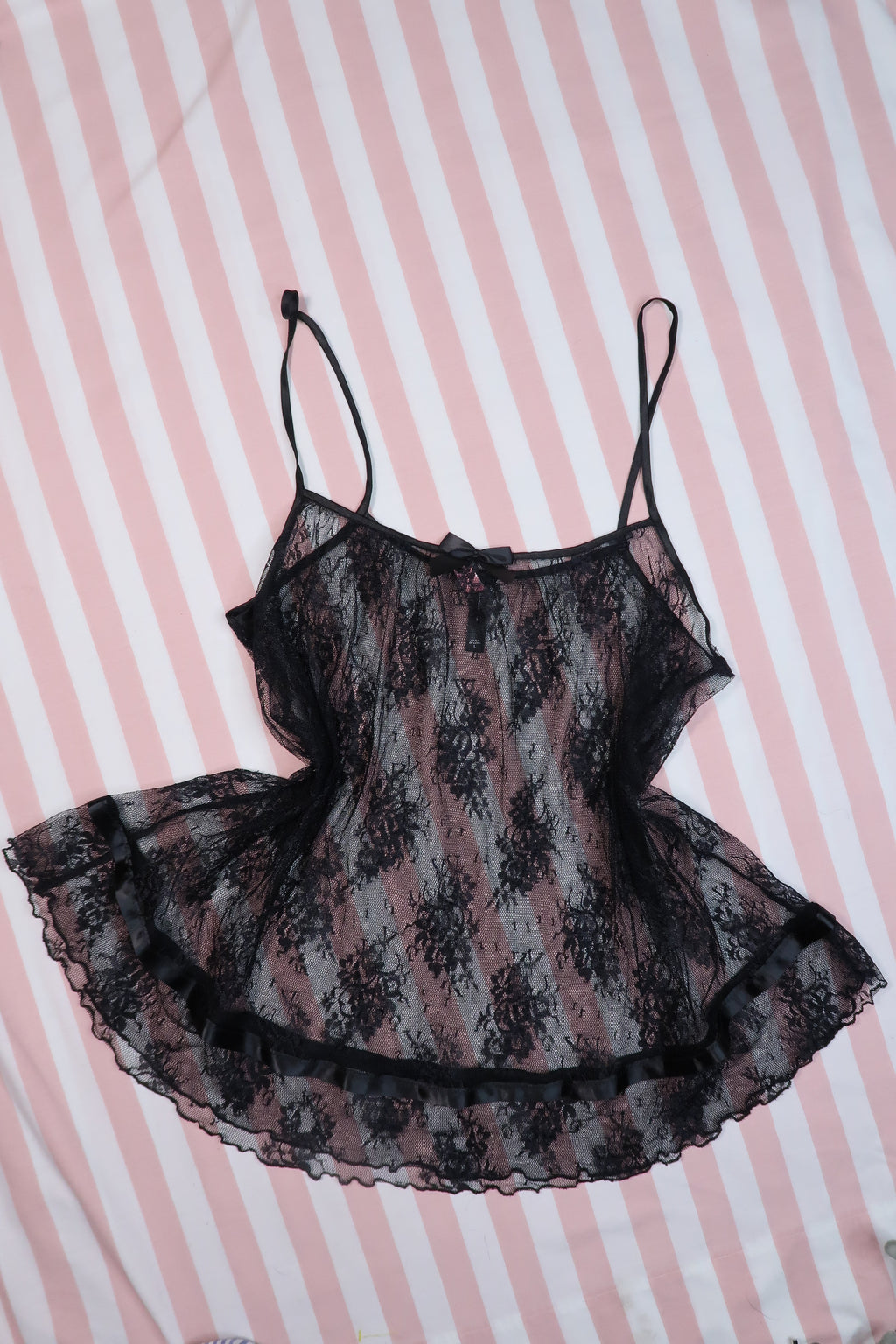Vintage 2000s Victoria’s Secret black lace babydoll camisole top for women, featuring sheer fabric and delicate lace details.