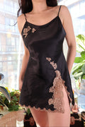Black satin lace slip dress from the 2000s Victoria’s Secret by Elektra Vintage, featuring delicate lace details and a vintage style.