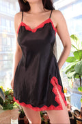 Elektra Vintage black dress with red lace trim, fitted style, featuring elegant lace details and a classic silhouette.