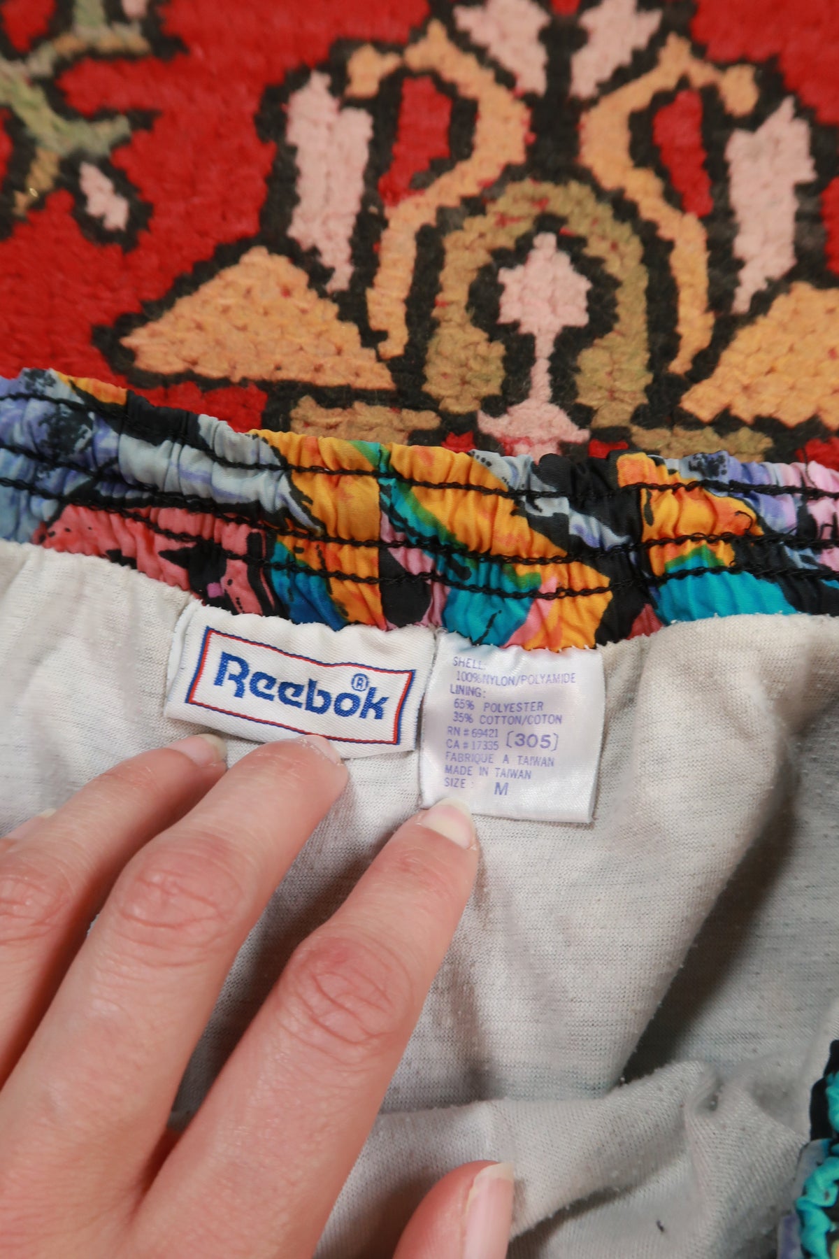 Women's Reebok vintage 90s abstract print running shorts with bold colorful design from Elektra Vintage.