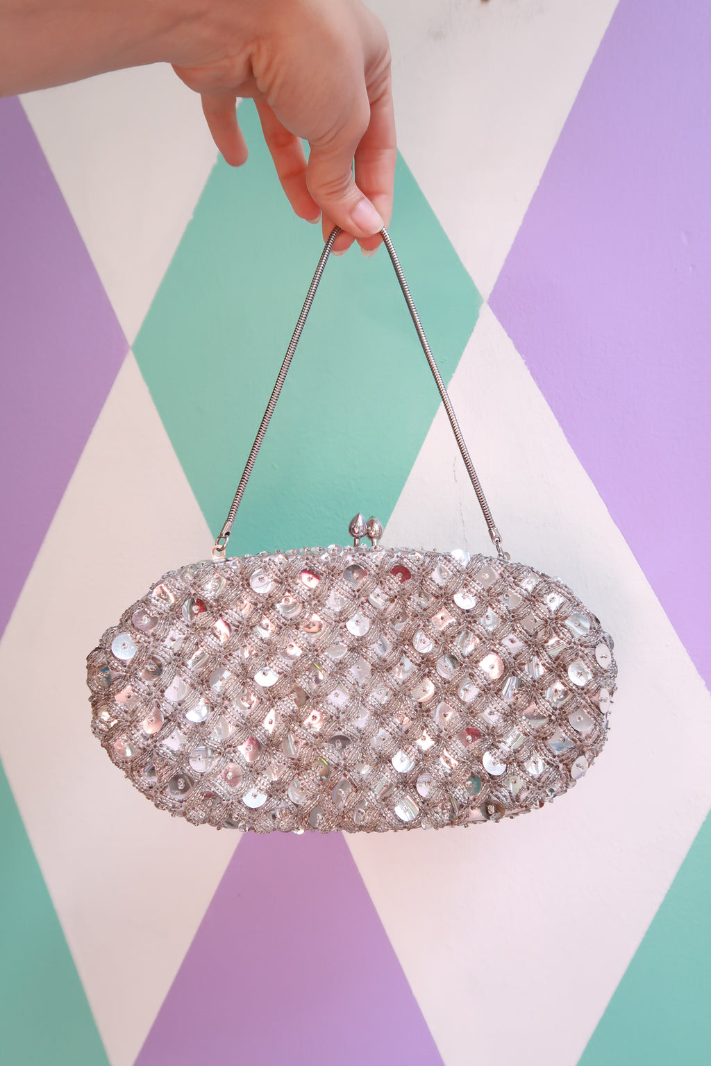 Vintage silver sequin beaded handbag by Elektra Vintage with intricate beadwork and a classic clutch style.