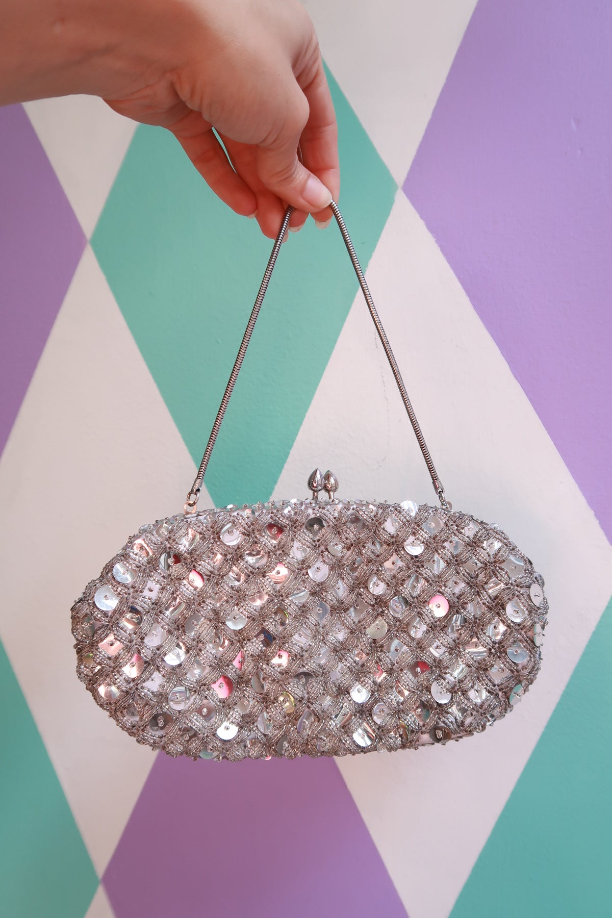 Vintage silver sequin beaded handbag from Elektra Vintage, featuring intricate beadwork and a classic bag design.