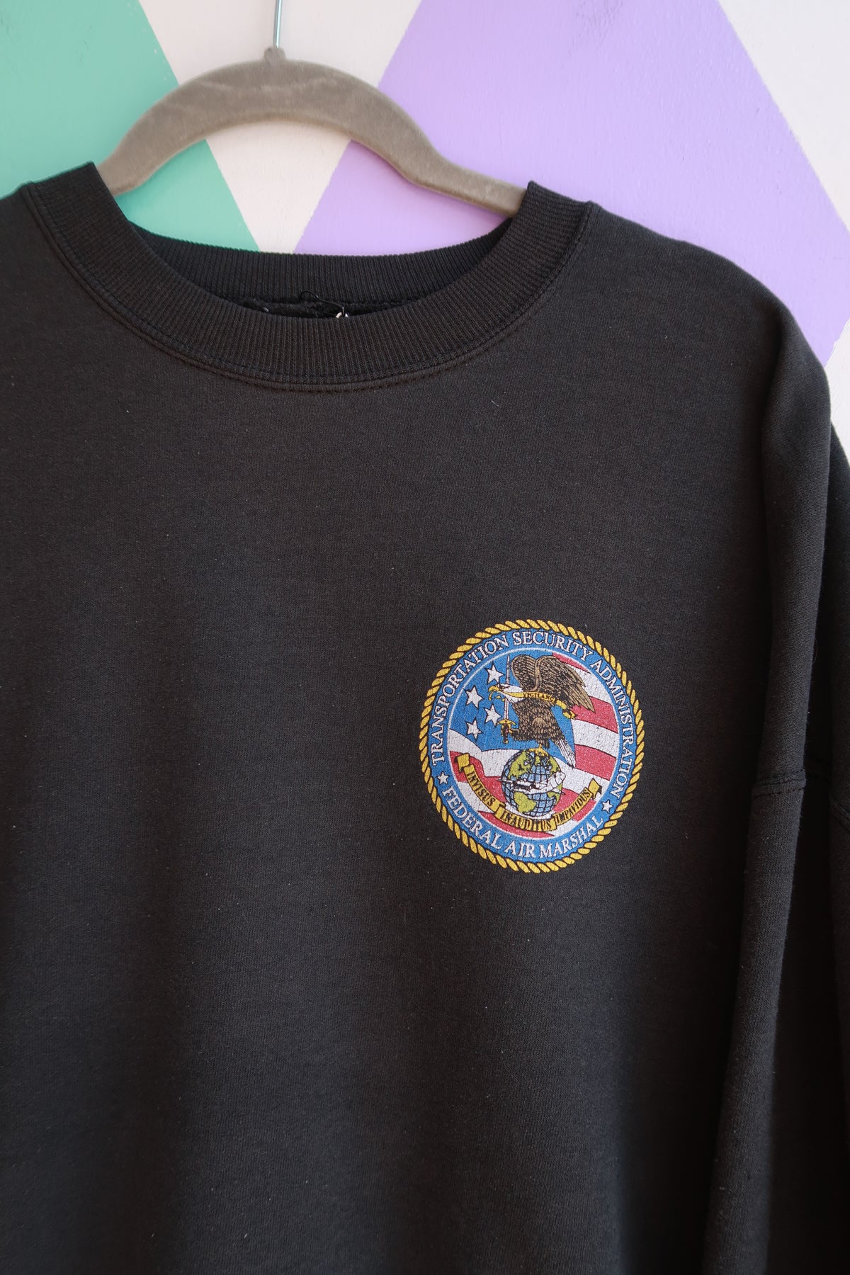 Elektra Vintage men's black crewneck sweatshirt featuring Vintage Transportation Security Administration Federal Air Marshal logo.