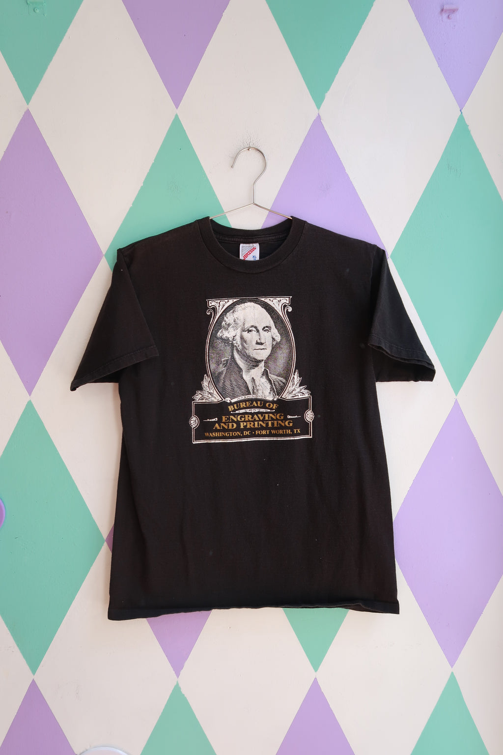 Vintage Elektra Vintage men's T-shirt featuring a black graphic of George Washington from the Bureau of Engraving and Printing.