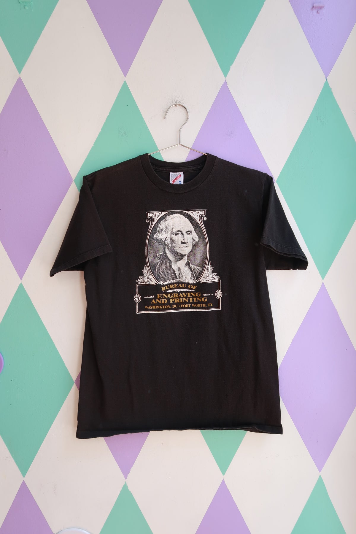 Vintage Elektra Vintage men's T-shirt featuring a black graphic of George Washington from the Bureau of Engraving and Printing.