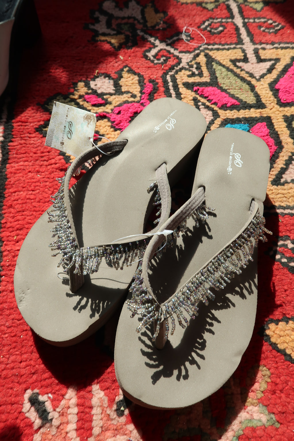 Elektra Vintage Y2K vintage beaded flip flops in taupe grey with intricate bead detailing and flat sole design.