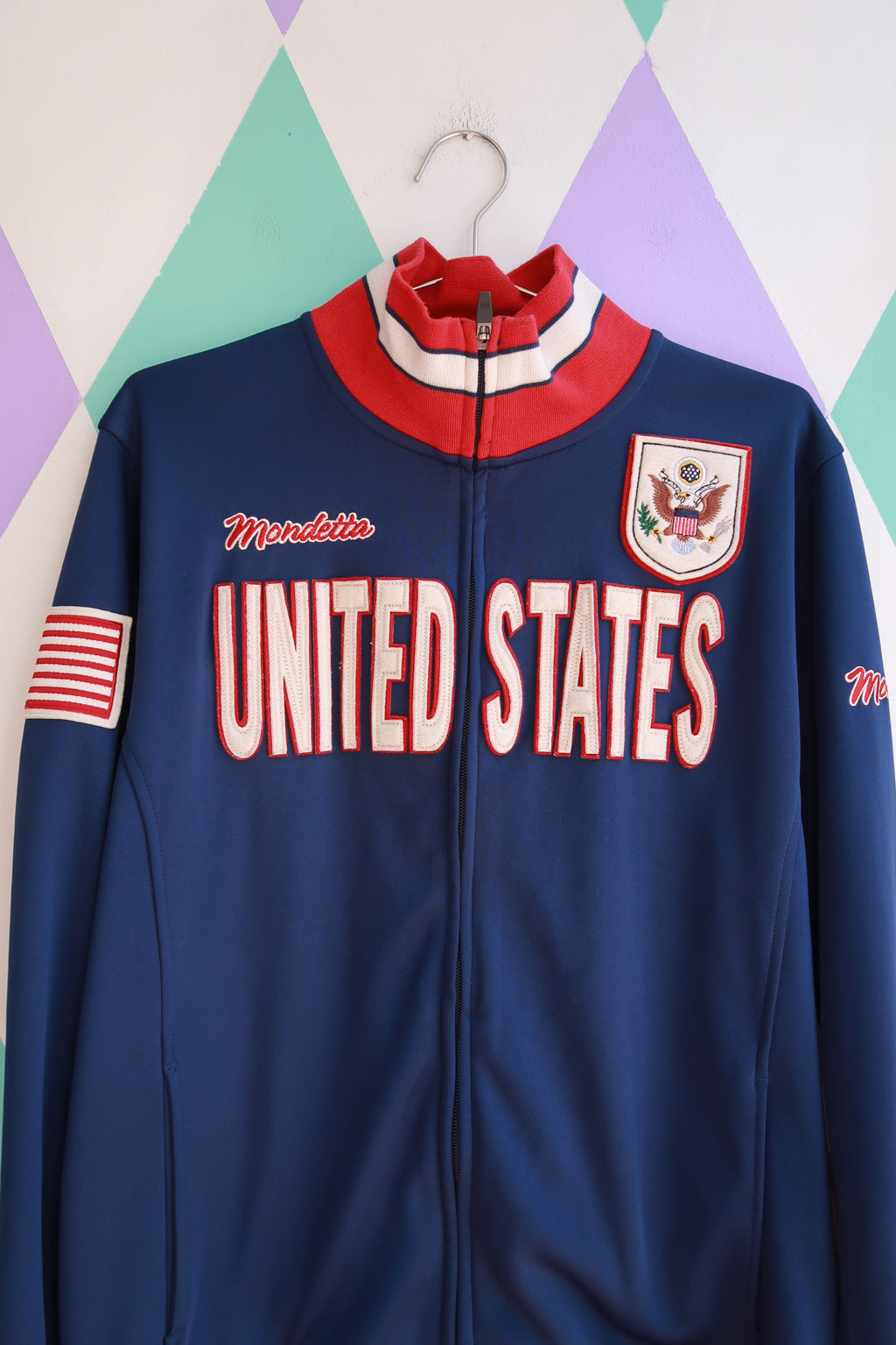 Vintage Mondetta U.S. Team full zip track jacket by Elektra Vintage, featuring classic design and team logo on front.