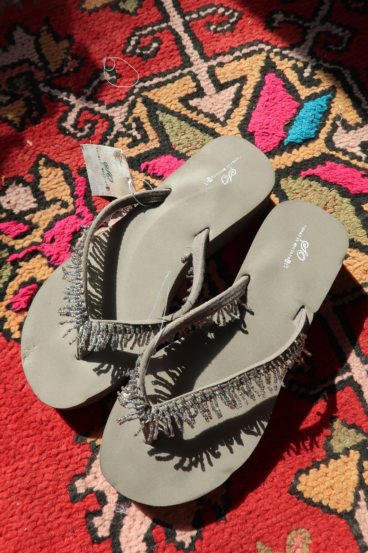 Elektra Vintage Y2K vintage beaded flip flops in taupe grey with colorful bead detailing on the straps.