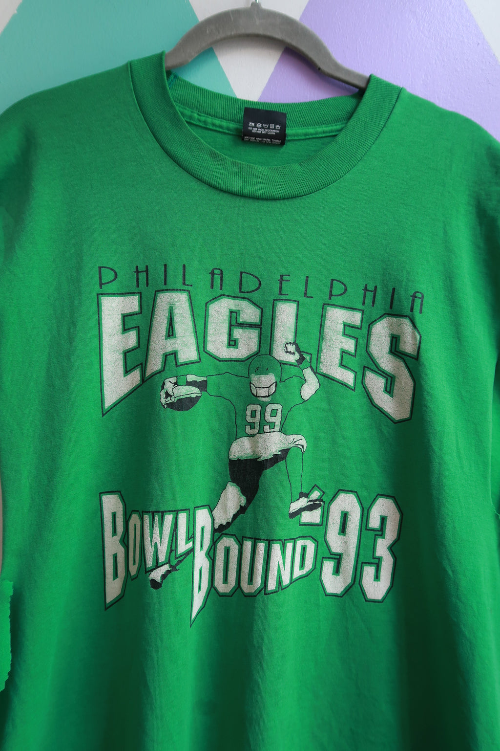 Men's vintage 1993 Philadelphia Eagles bowl bound sleeveless graphic T-shirt by Elektra Vintage, featuring team logo and retro design.