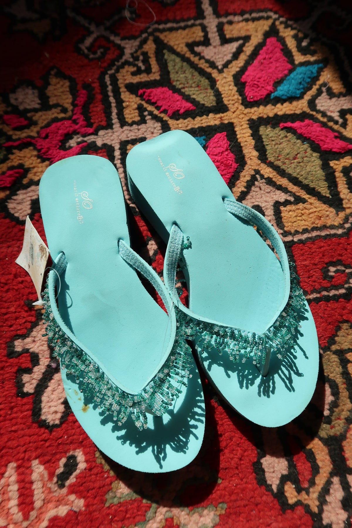 Turquoise Y2K vintage beaded flip flops by Elektra Vintage with colorful bead accents and casual summer style.
