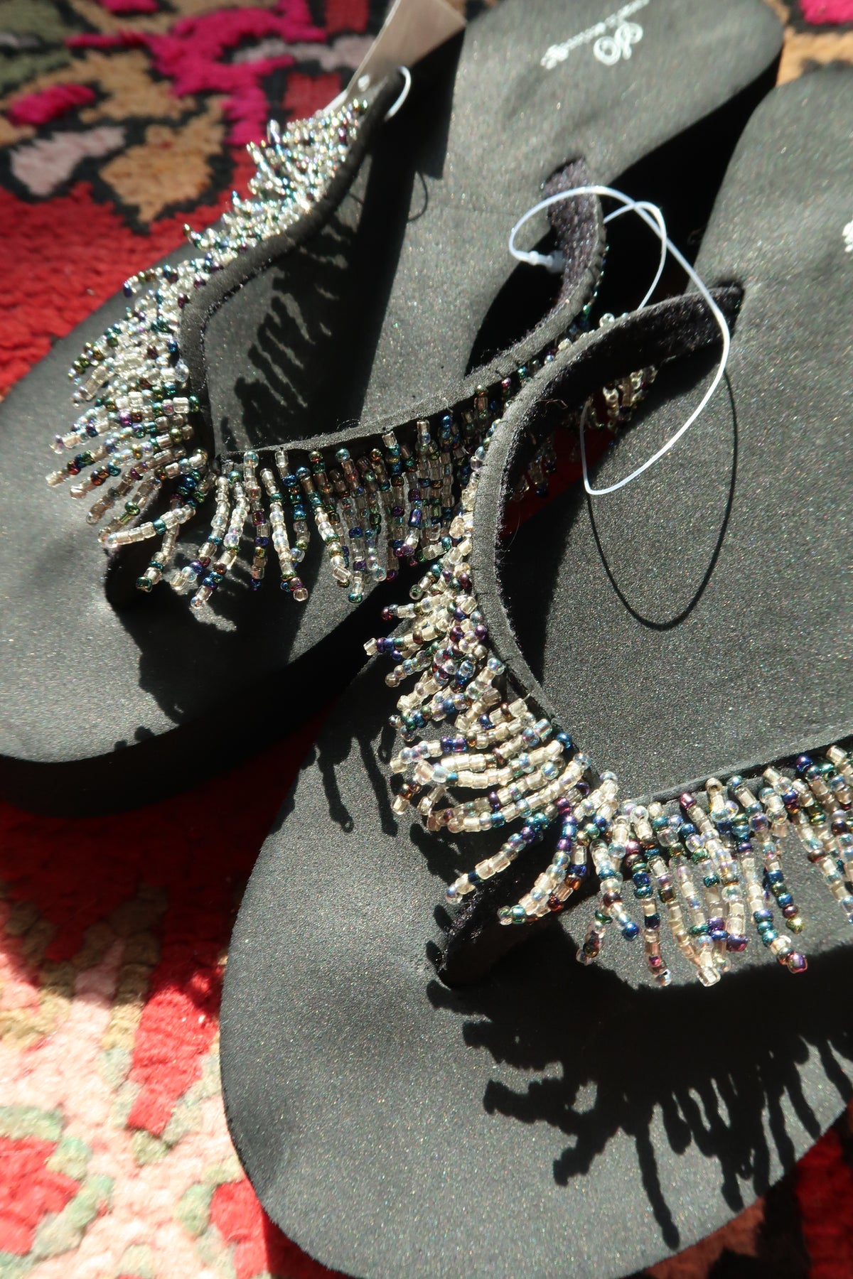 Black Y2K vintage beaded flip flops by Elektra Vintage with colorful beaded straps, new with tags.