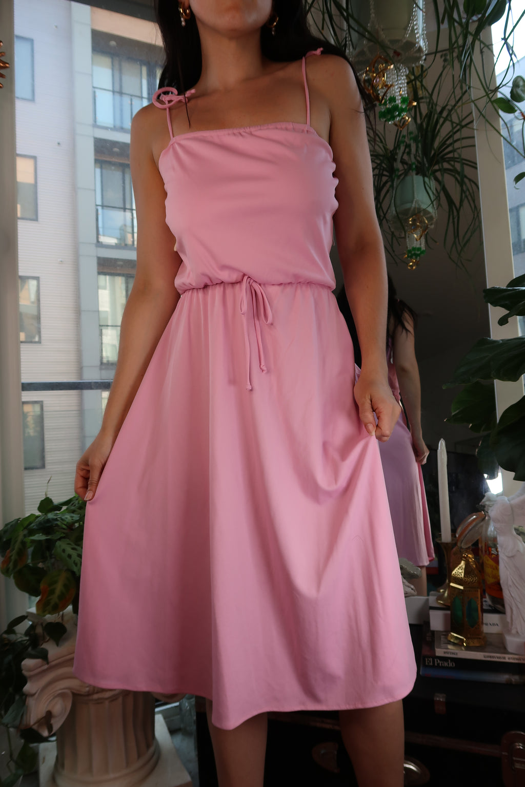 Pink 1970s tie-strap midi dress by Elektra Vintage, soft jersey knit fabric, vintage style, with a fitted waist and feminine silhouette.