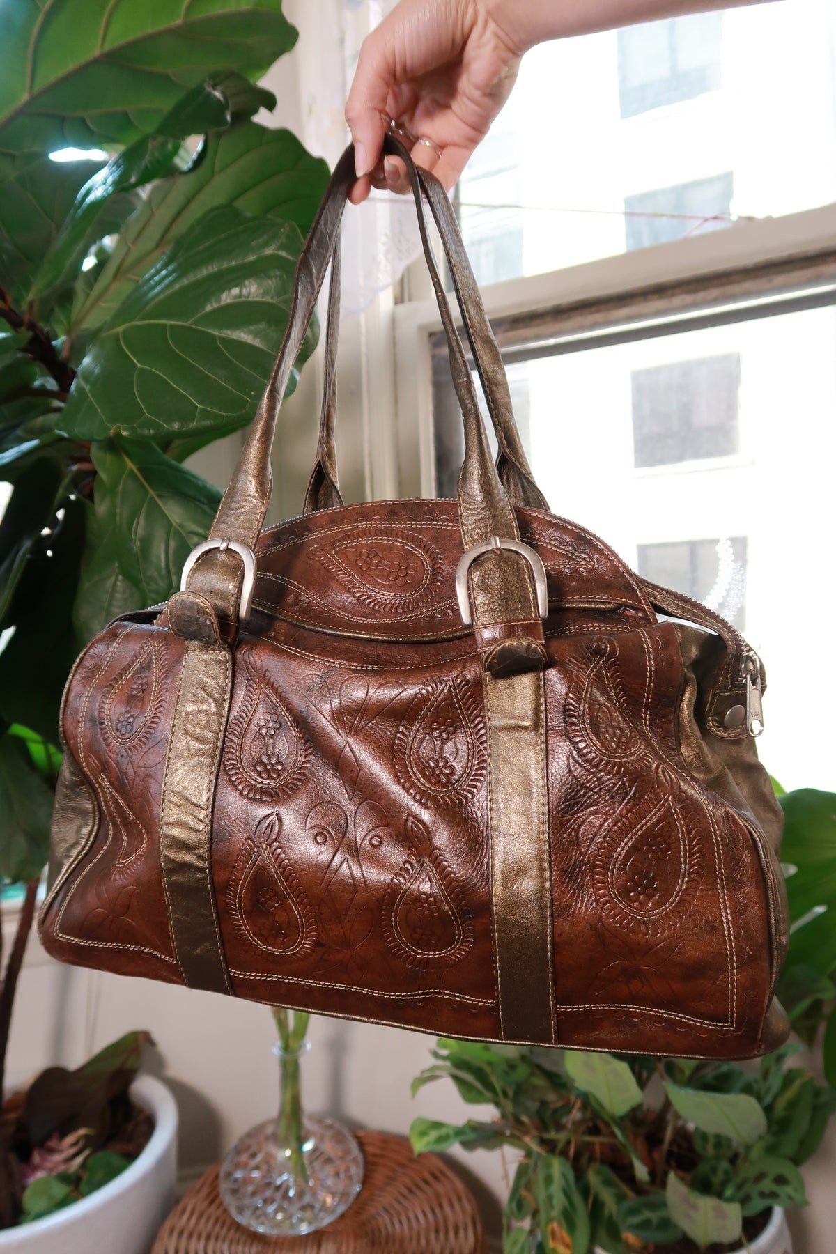 Vintage leather and metallic bronze shoulder bag by Elektra Vintage, featuring embossed western-style design and detailed tooling.