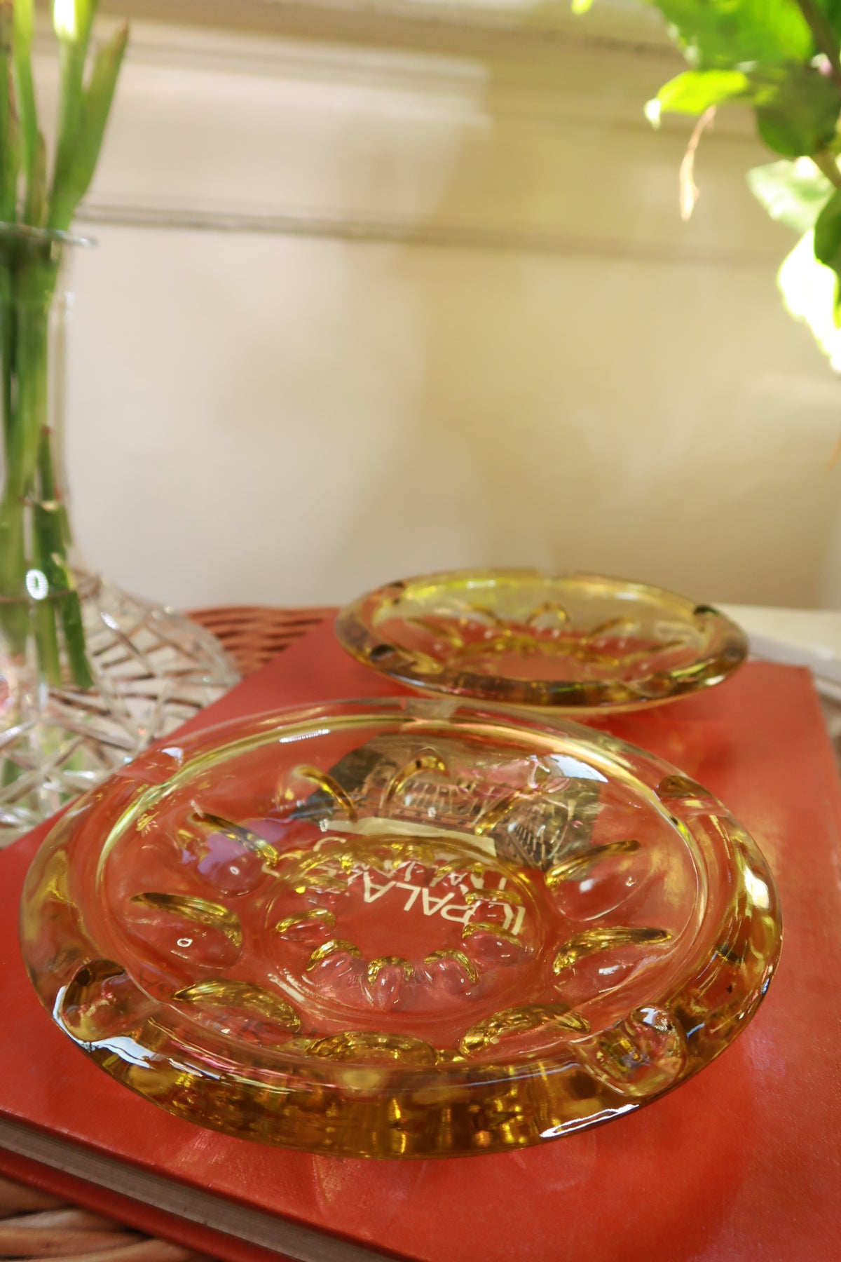 Vintage amber glass round cigarette ashtray by Elektra Vintage, featuring heavy pressed glass with smooth, rounded edges.