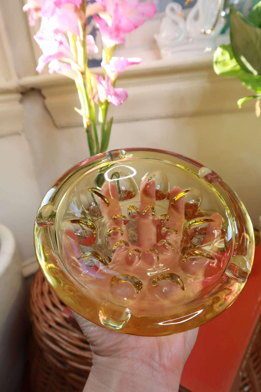 Vintage amber glass round cigarette ashtray with heavy pressed glass, featuring a smooth, glossy surface and classic design.
