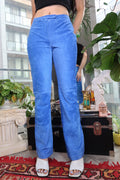 Vintage electric blue suede women's pants by Elektra Vintage, showcasing the stylish, fitted design and smooth suede texture.