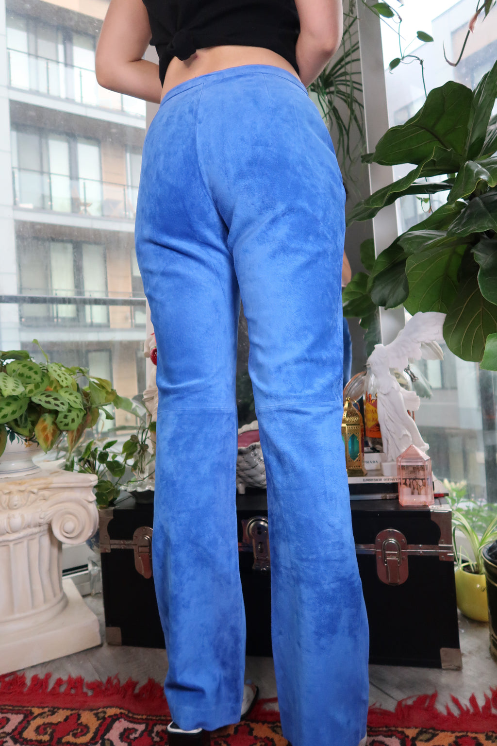 Electric blue suede women's pants by Elektra Vintage, showcasing smooth texture and stylish fit on a model.
