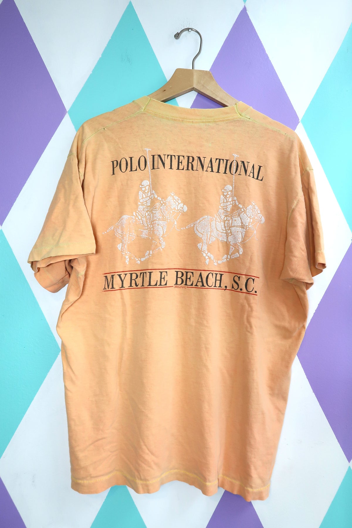 Vintage "Polo International" Myrtle Beach Graphic Tee – Distressed Peach Souvenir Shirt