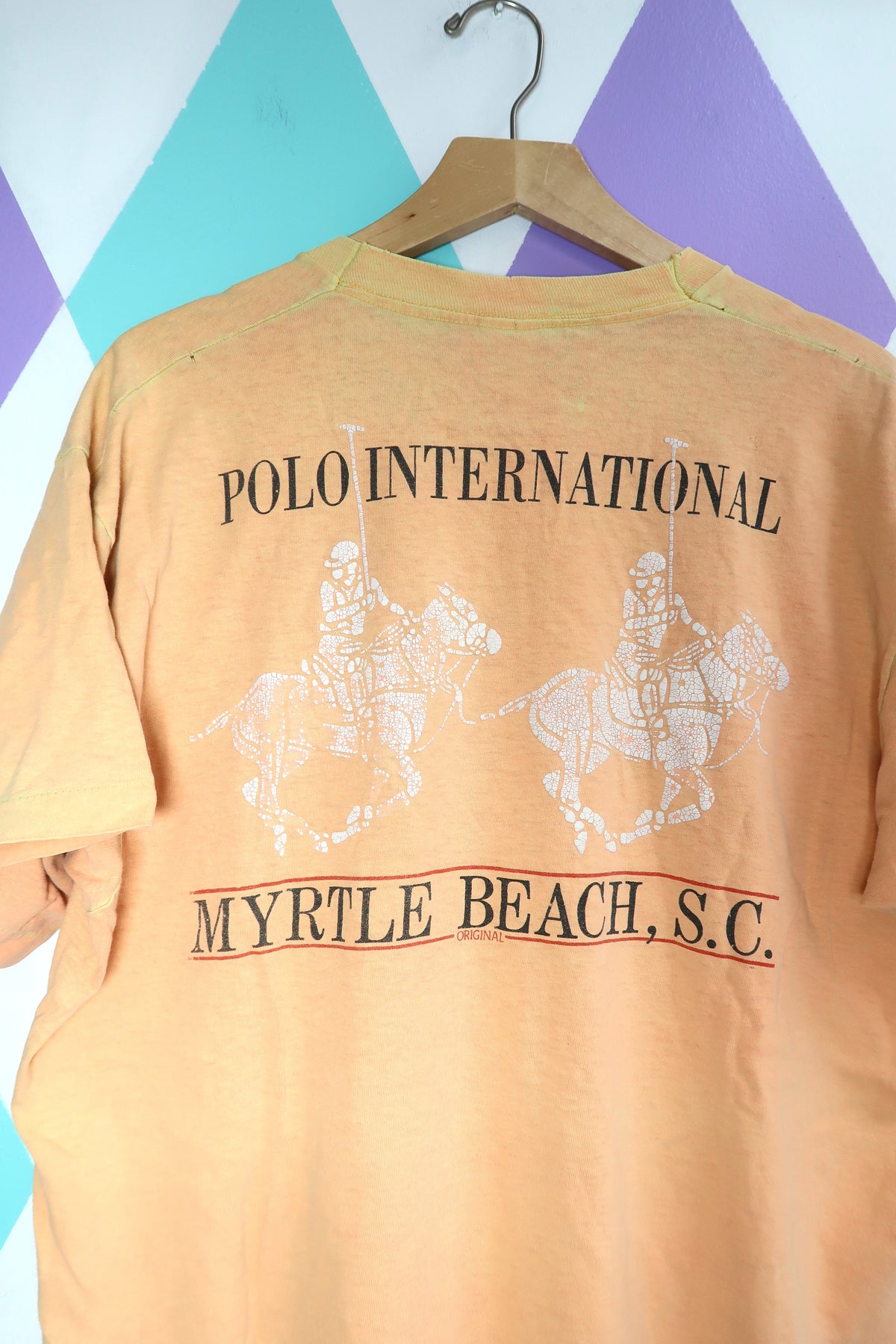 Vintage "Polo International" Myrtle Beach Graphic Tee – Distressed Peach Souvenir Shirt