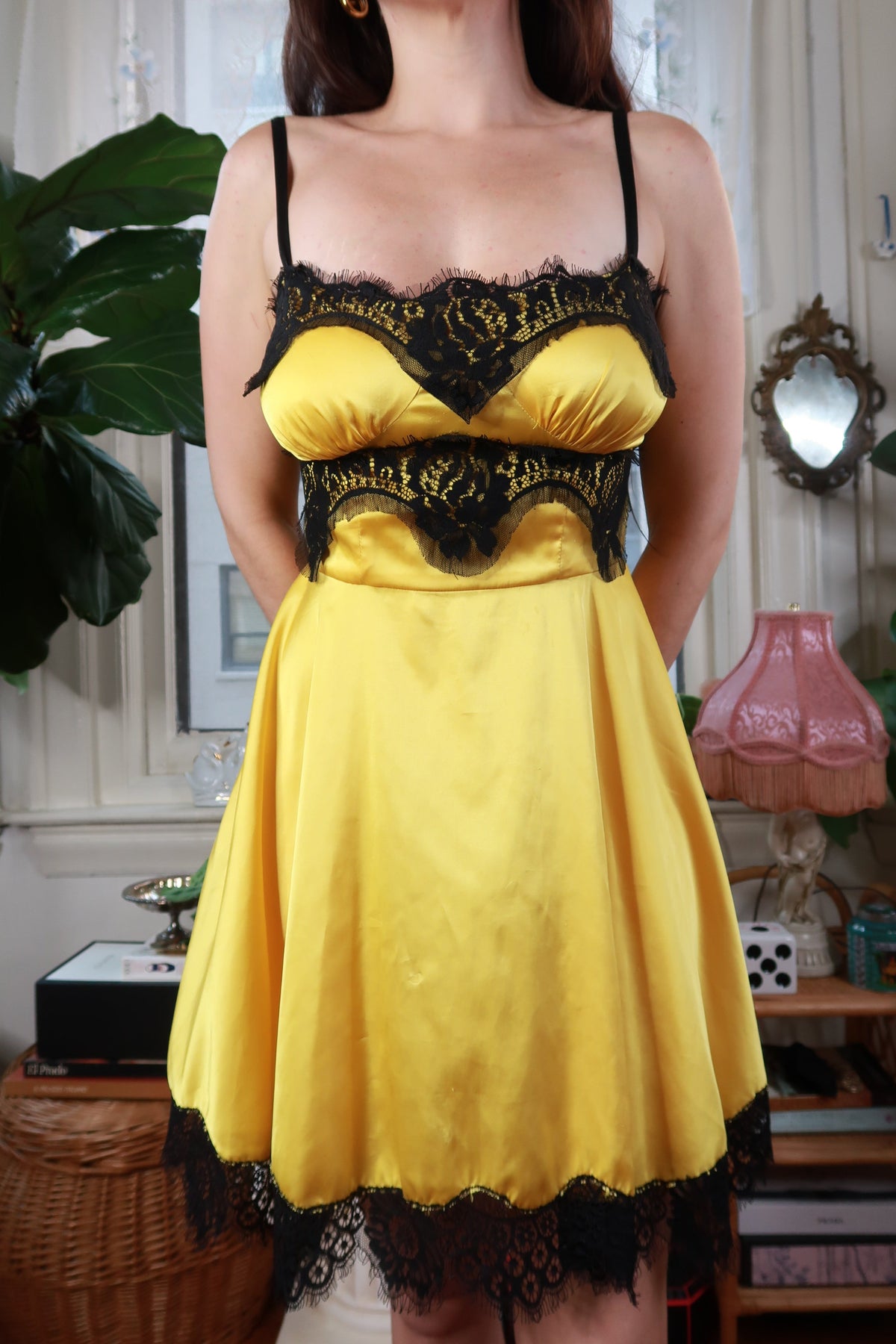 Vintage yellow satin lace corset mini dress by Dolce & Gabbana, styled with elegant lace details and a Y2K-inspired silhouette.