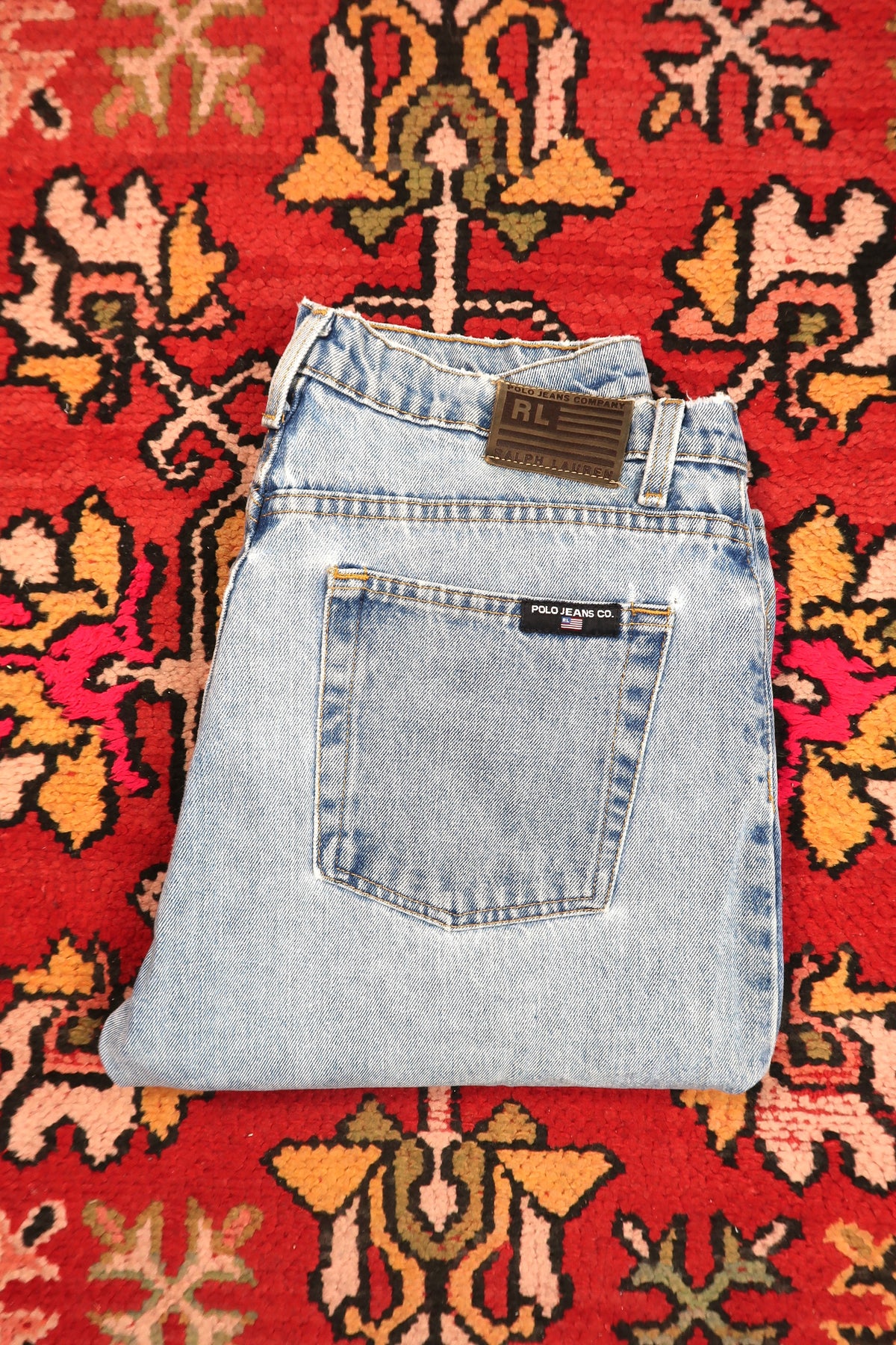 Men's vintage light wash distressed denim jeans from Polo Jeans Co. by Elektra Vintage, showcasing worn-in style and classic fit.