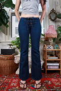 Dark wash vintage Y2K lace-up low-rise flare jeans for women by Elektra Vintage, showing the high waist and flared leg design.