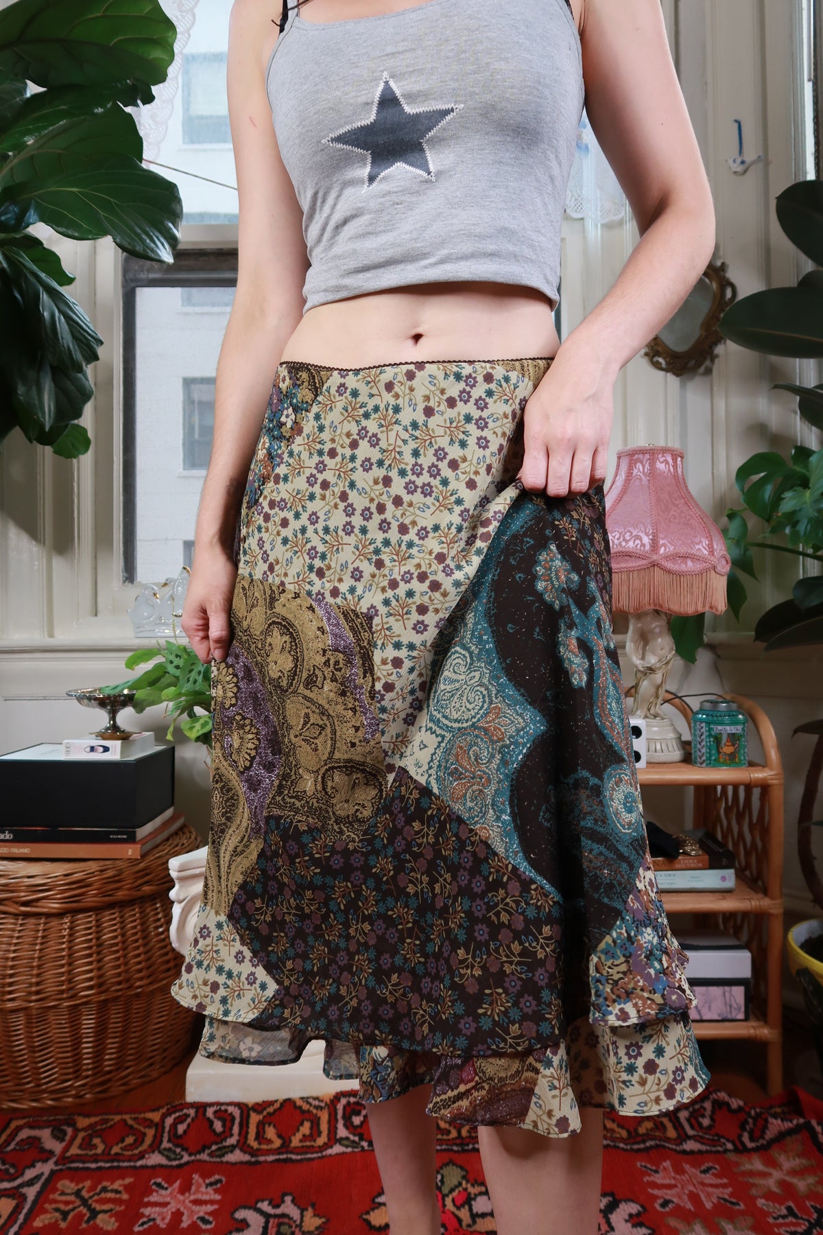 Vintage Y2K patchwork floral paisley midi skirt by Elektra Vintage featuring colorful fabric and flowing handkerchief hem.