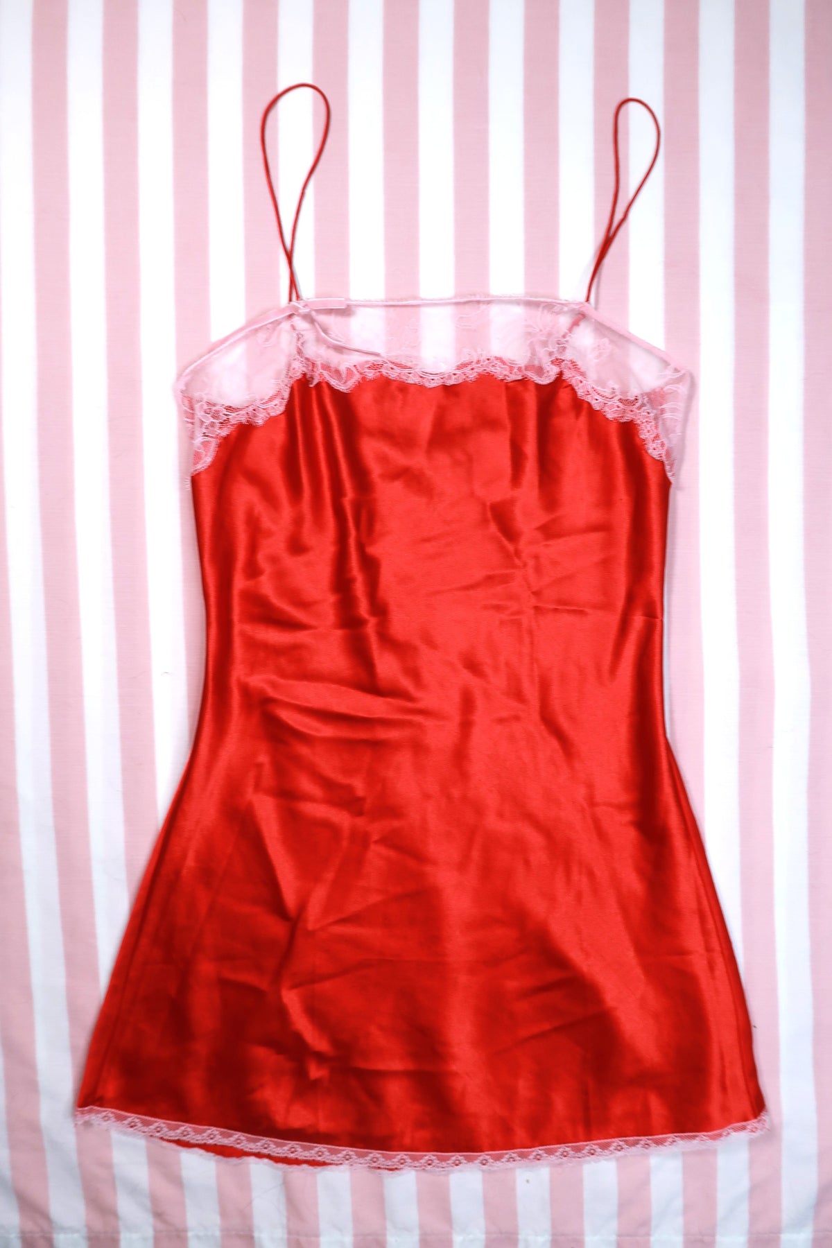 Vintage 2000s Victoria’s Secret red satin lace trim slip dress by Elektra Vintage, featuring elegant satin fabric and delicate lace accents.