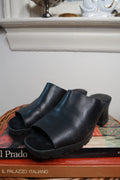 Black vintage leather platform mule heels with chunky slip-on design by Elektra Vintage, featuring a stylish and comfortable open-toe sandal.