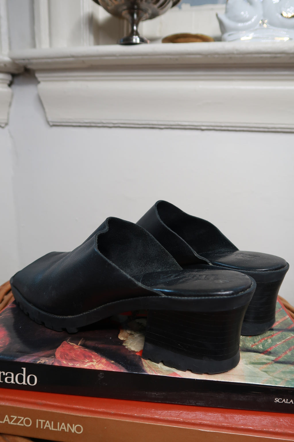 Black vintage leather platform mule heels by Elektra Vintage, chunky slip-on sandals with a stylish and comfortable design.