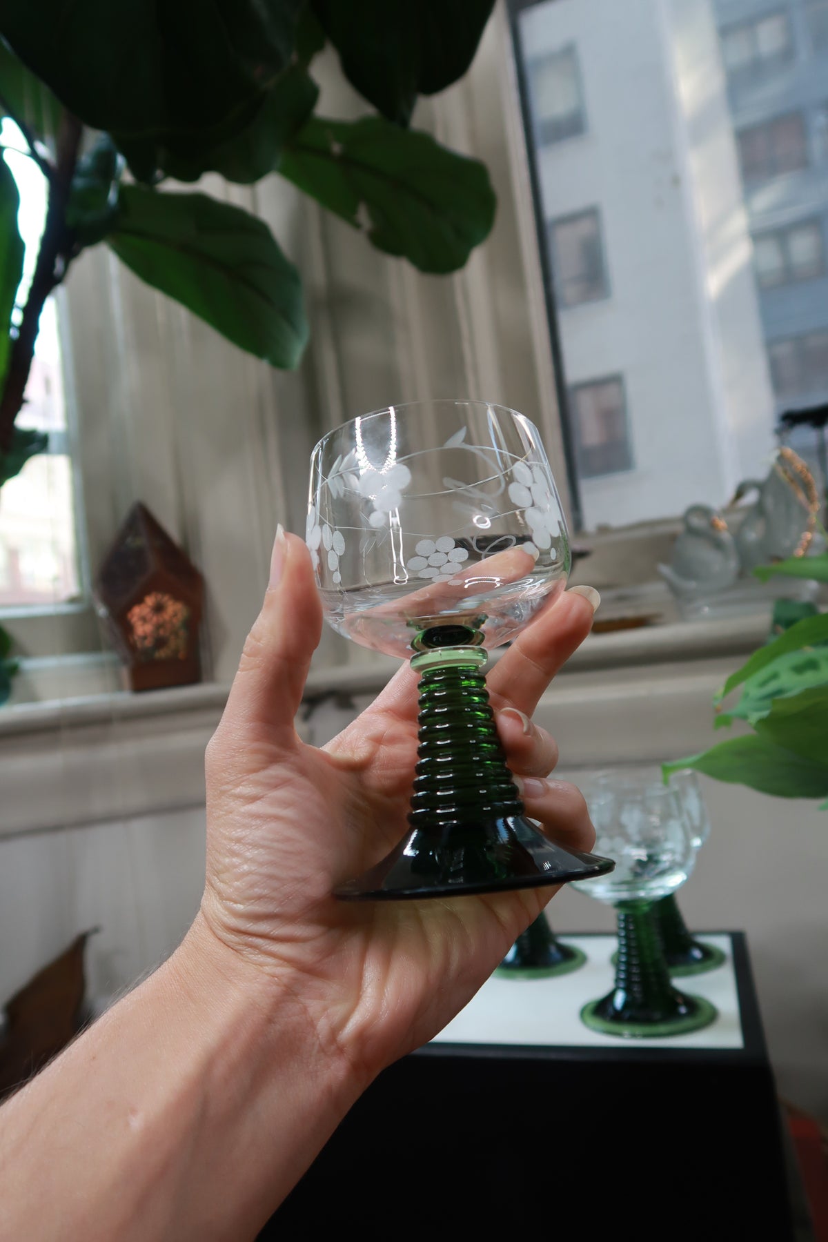 Six vintage green etched grape stem cordial wine glasses from Elektra Vintage, with detailed etched grape designs on clear glass.