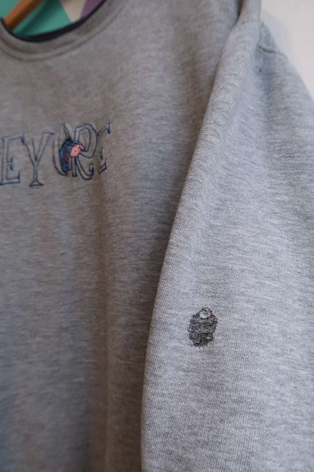 Vintage Eeyore embroidered crewneck sweatshirt by Elektra Vintage, featuring a cozy design and classic silhouette.