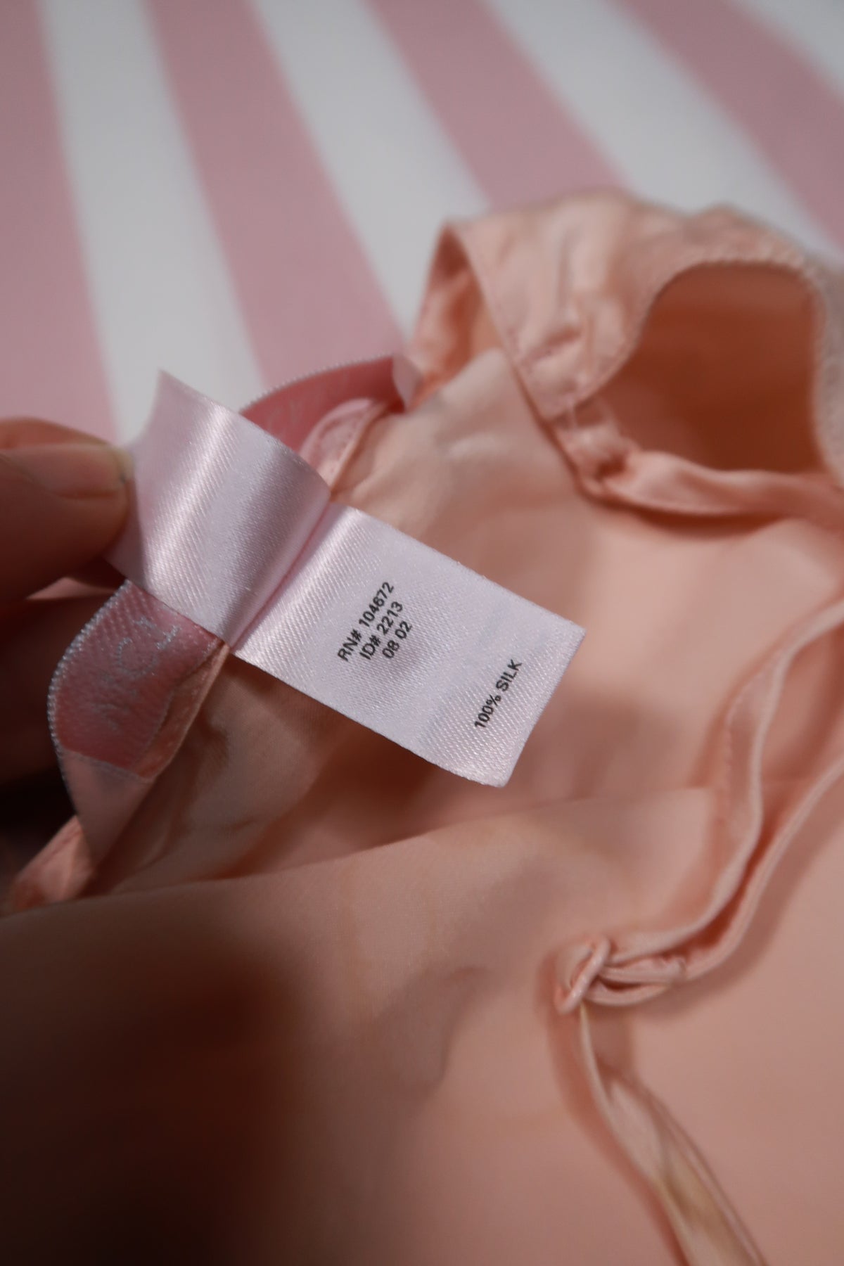 Vintage 2000s Victoria’s Secret peach silk slip dress with lace trim, featuring elegant spaghetti straps and delicate detailing.
