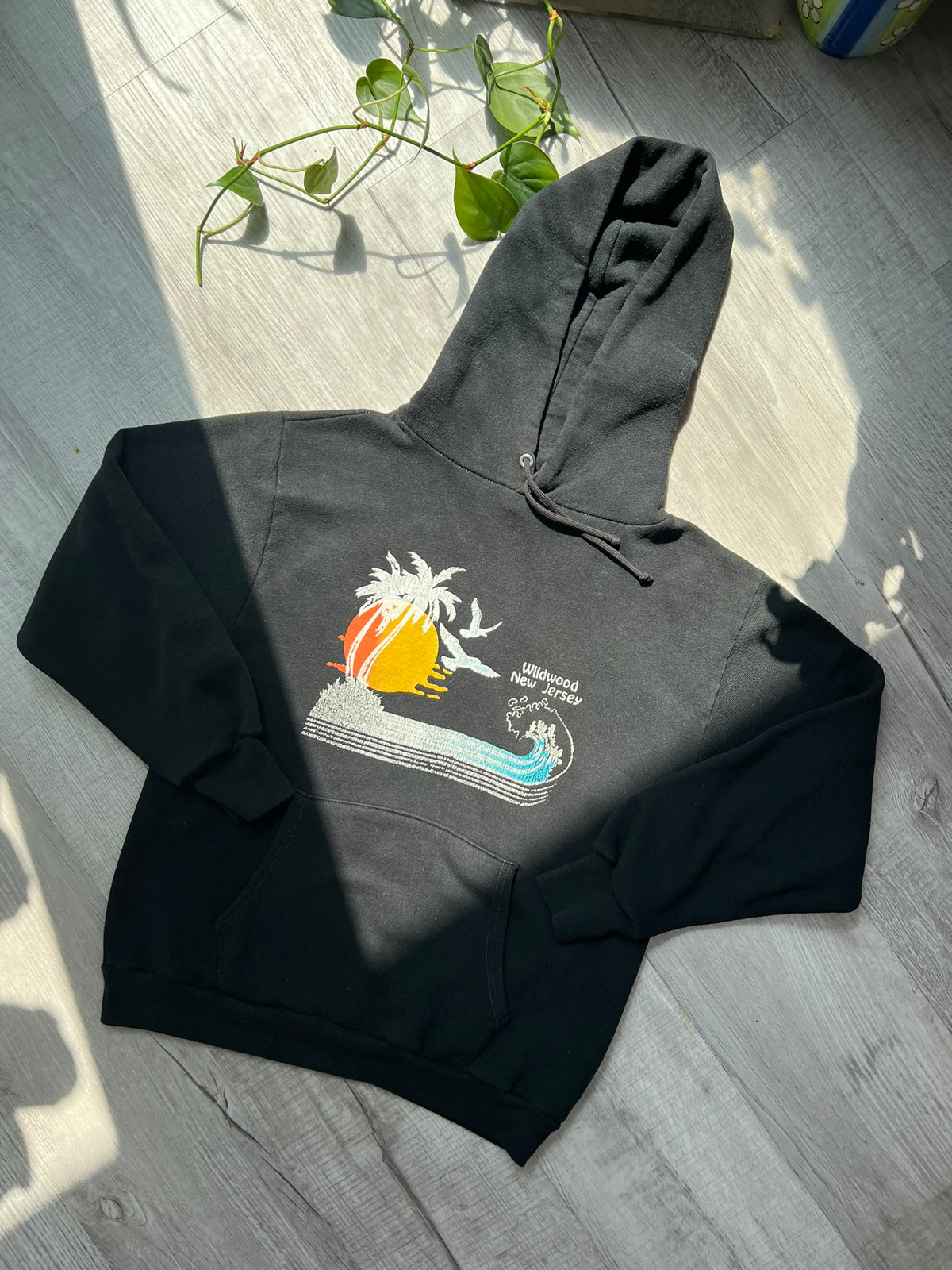 Black Russell hoodie with vintage Wildwood New Jersey design, featuring bold print and classic 80s style from Elektra Vintage.