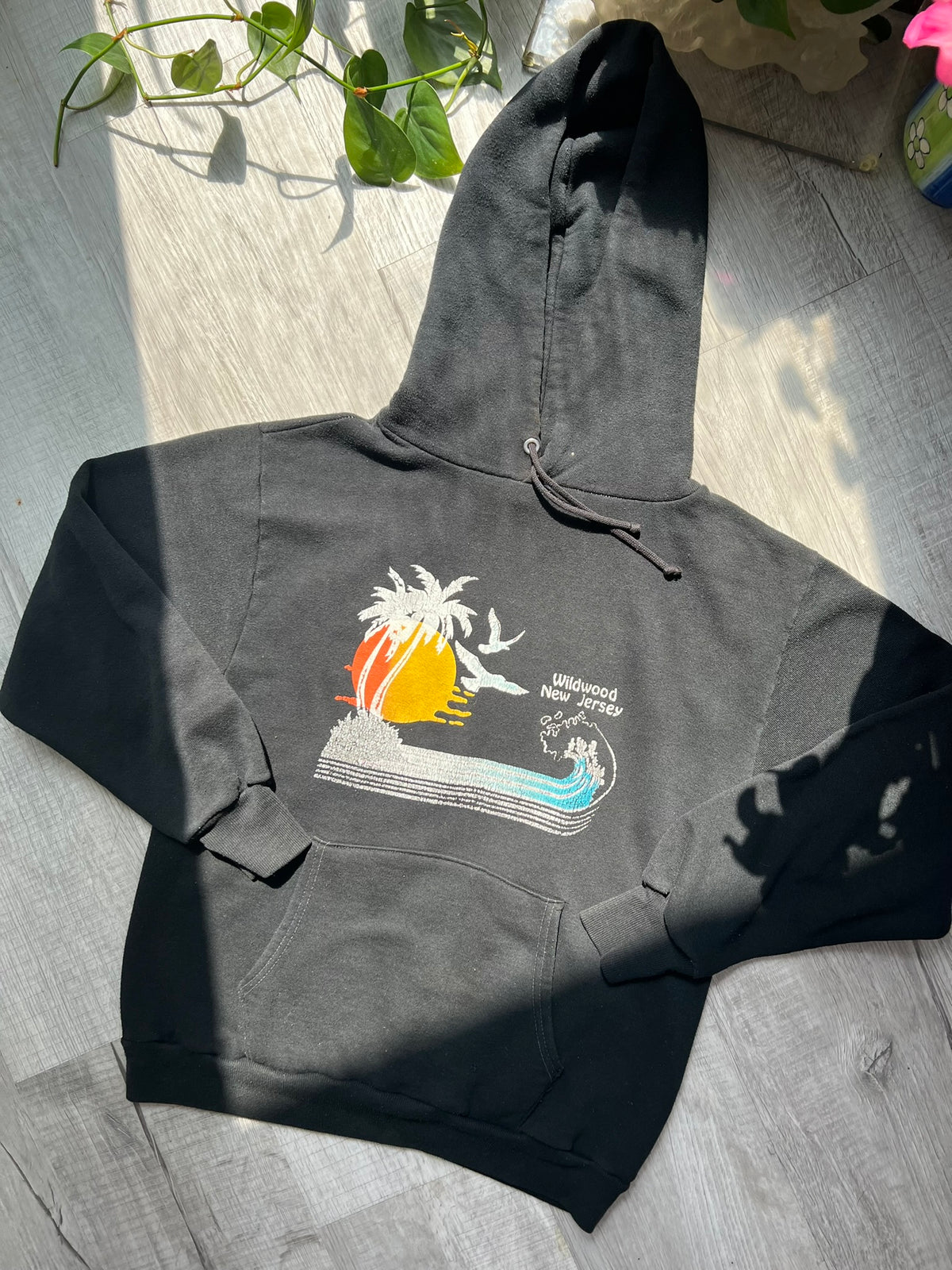Black 80s vintage Wildwood New Jersey Russell hoodie featuring retro style and Elektra Vintage branding.